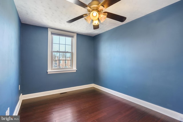 unfurnished room featuring ceiling fan, wood-type flooring, and a textured ceiling