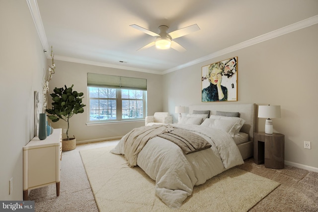 carpeted bedroom featuring ceiling fan and crown molding