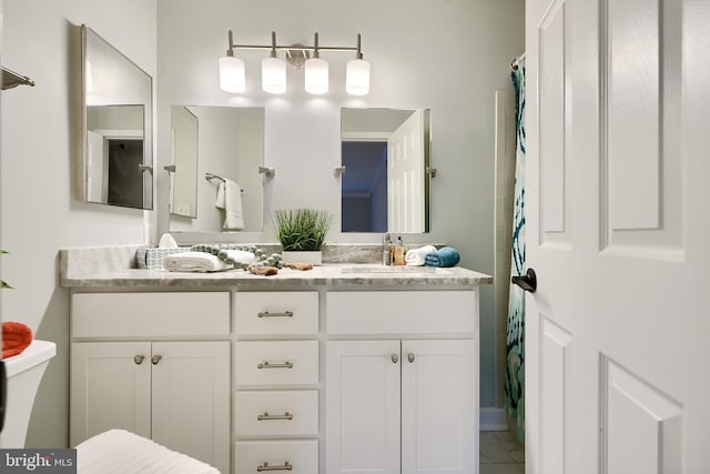 bathroom featuring vanity and tile patterned flooring