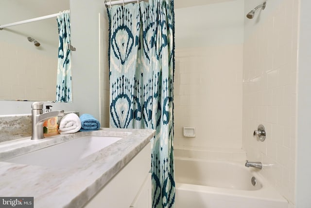 bathroom with shower / bath combination with curtain and vanity