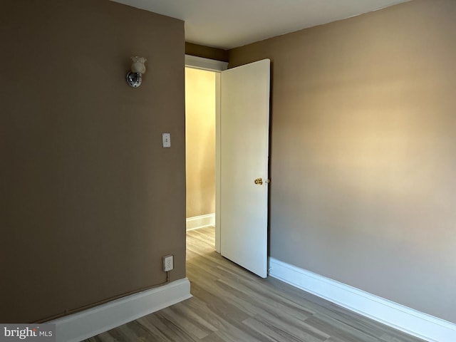 spare room with light wood-type flooring