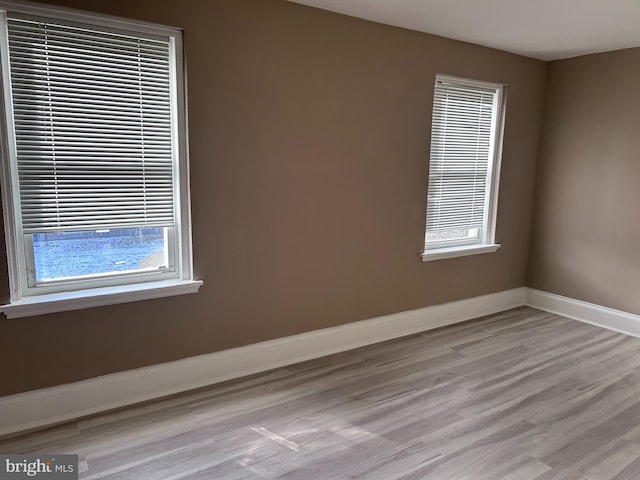 unfurnished room featuring light wood-type flooring