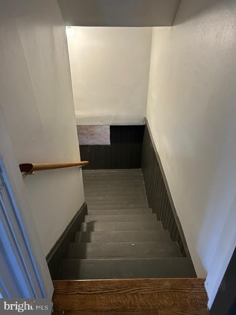 stairs with wood finished floors