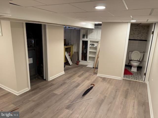 basement with hardwood / wood-style flooring