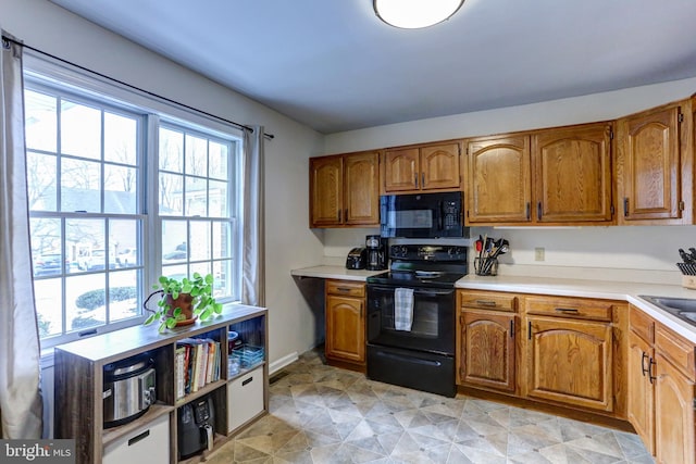 kitchen featuring sink and black appliances