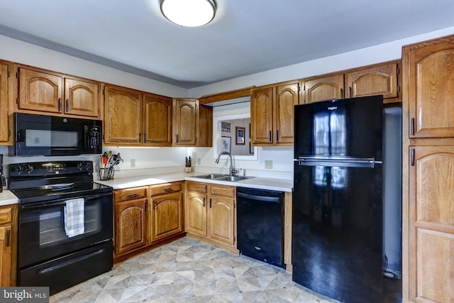 kitchen with black appliances and sink