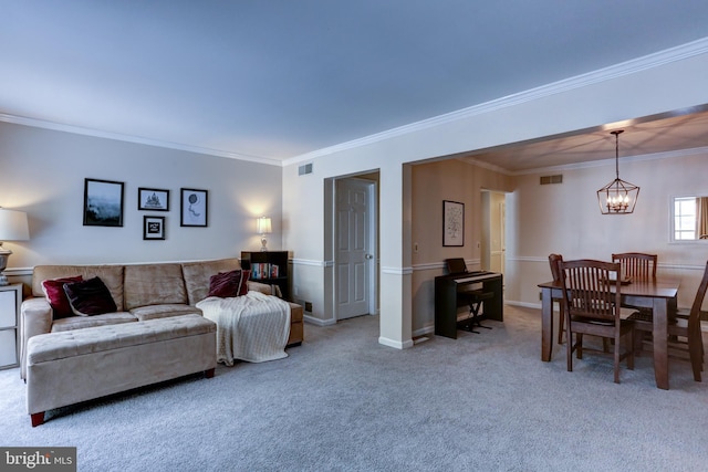 living room with carpet floors, ornamental molding, and a notable chandelier