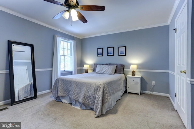 carpeted bedroom with ceiling fan and crown molding