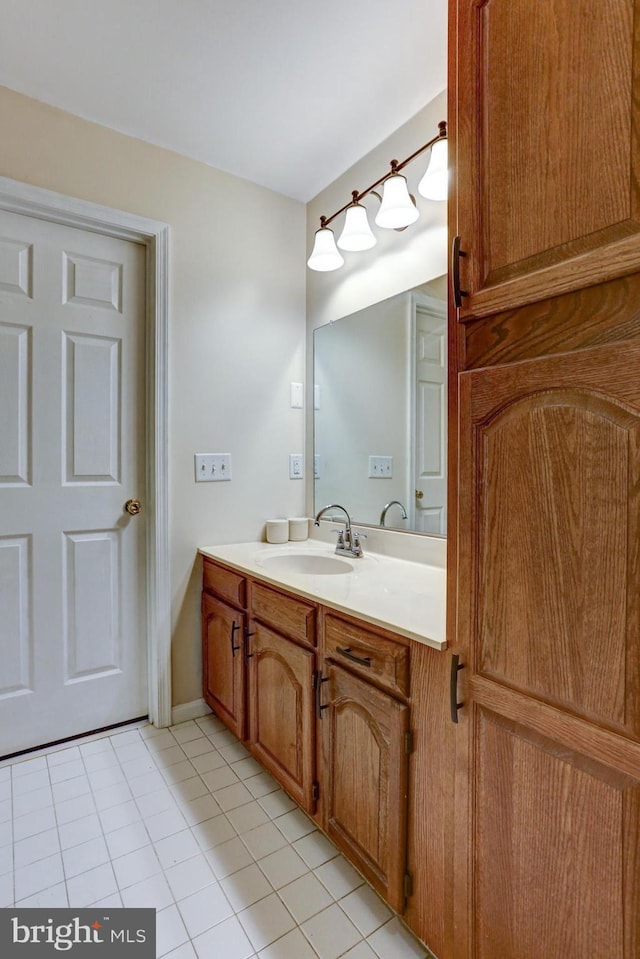 bathroom featuring tile patterned flooring and vanity