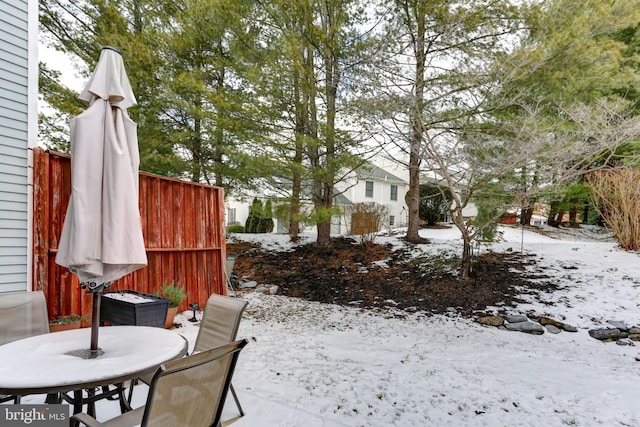 view of yard layered in snow