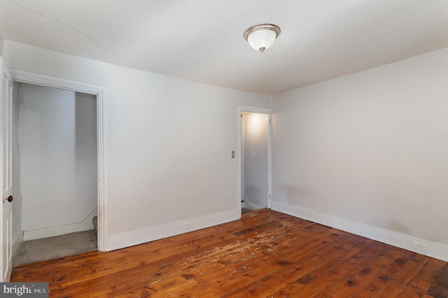 spare room featuring hardwood / wood-style flooring