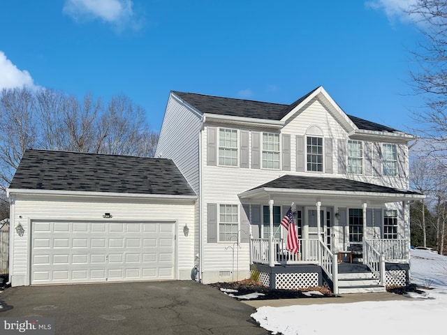 view of front of house with a porch and a garage