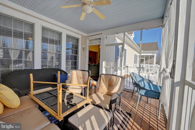 sunroom / solarium with ceiling fan