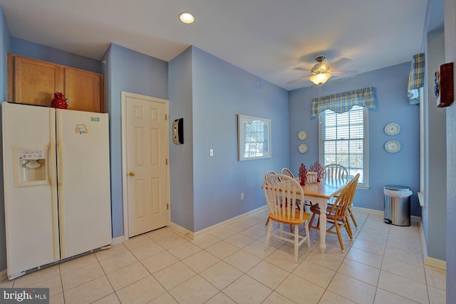 dining room featuring ceiling fan and light tile patterned floors