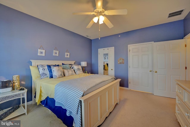 bedroom featuring ceiling fan and light colored carpet