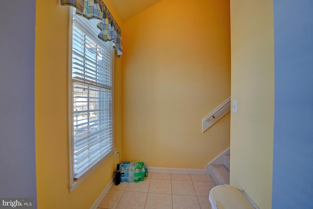 bathroom with toilet and tile patterned floors