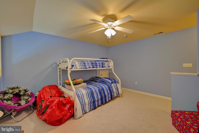 carpeted bedroom featuring vaulted ceiling and ceiling fan