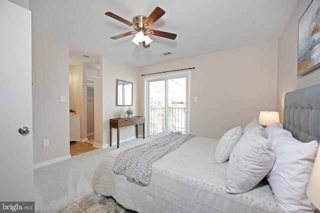 carpeted bedroom featuring access to exterior and ceiling fan