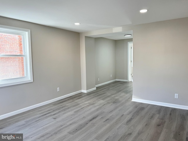 empty room featuring light wood-type flooring and a wealth of natural light