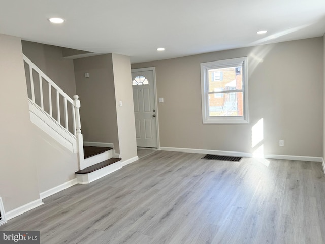 entryway with light hardwood / wood-style flooring