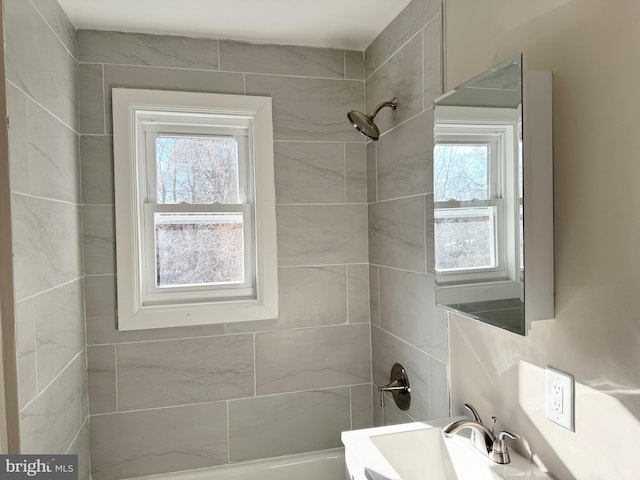 bathroom with sink and a wealth of natural light