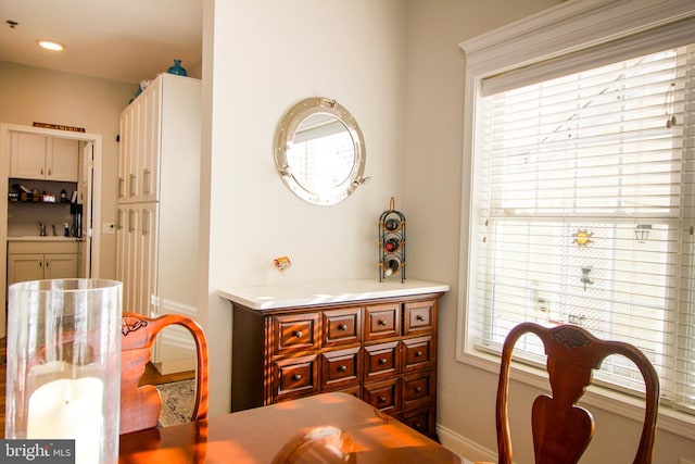 dining area featuring a wealth of natural light and sink