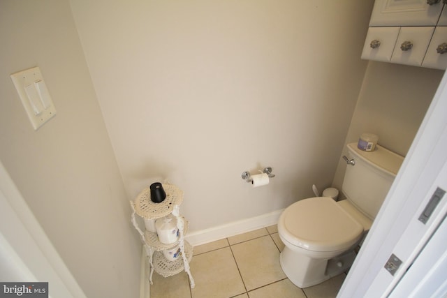 bathroom featuring toilet and tile patterned floors