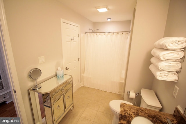 full bathroom featuring vanity, shower / bath combination with curtain, and toilet