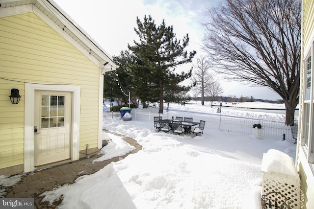 view of yard layered in snow