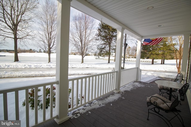 view of snow covered deck