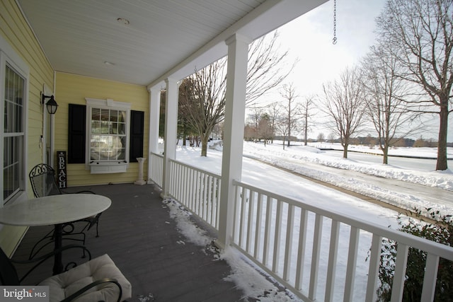 view of snow covered deck