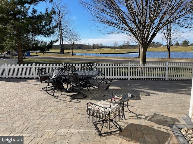 view of patio / terrace with a water view