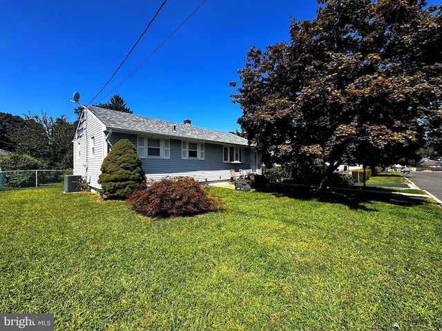 view of home's exterior featuring a lawn and central air condition unit