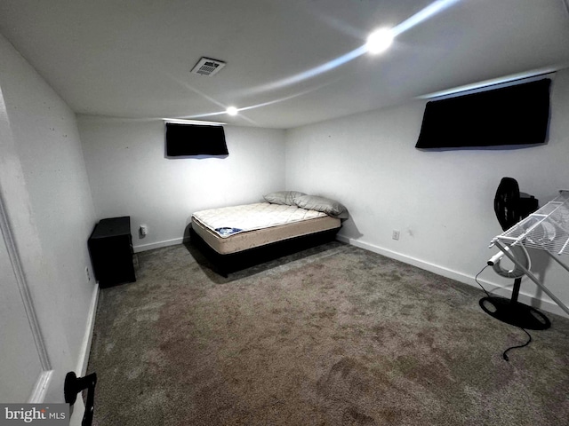 unfurnished bedroom with dark colored carpet