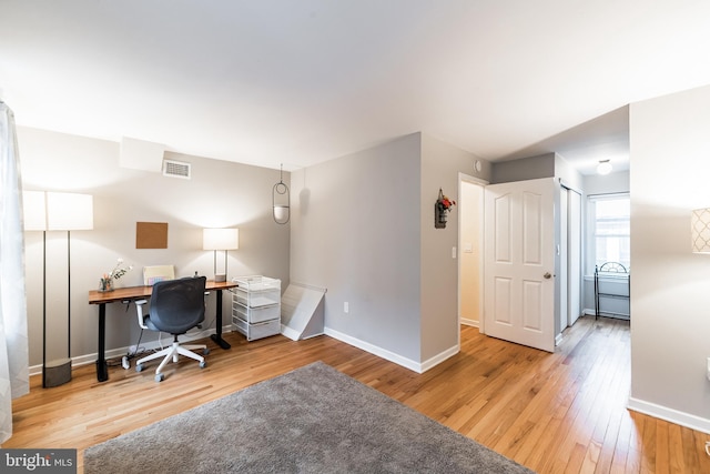 office area with hardwood / wood-style floors