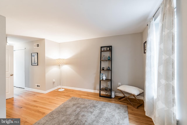 unfurnished room featuring hardwood / wood-style flooring