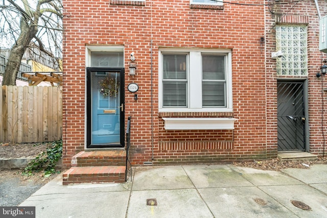 property entrance with a patio