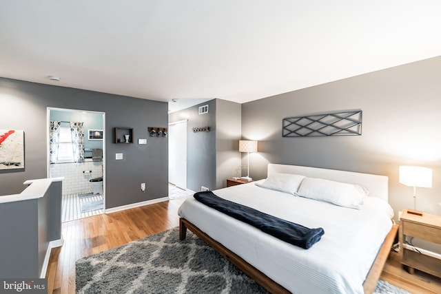 bedroom featuring wood-type flooring