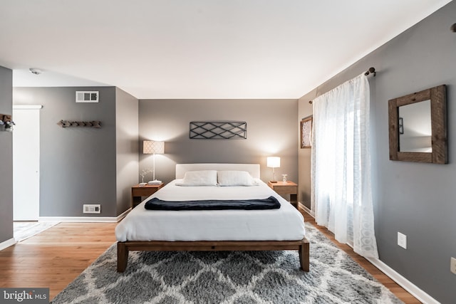 bedroom featuring wood-type flooring