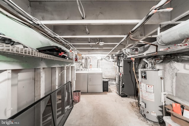 basement with separate washer and dryer, heating unit, and water heater