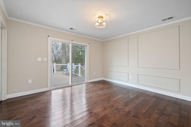 unfurnished room featuring dark wood-type flooring, crown molding, visible vents, and baseboards