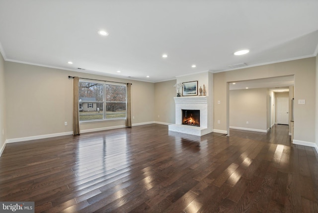 unfurnished living room featuring dark wood finished floors, visible vents, and crown molding