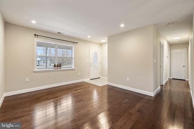 foyer with hardwood / wood-style flooring, recessed lighting, and baseboards