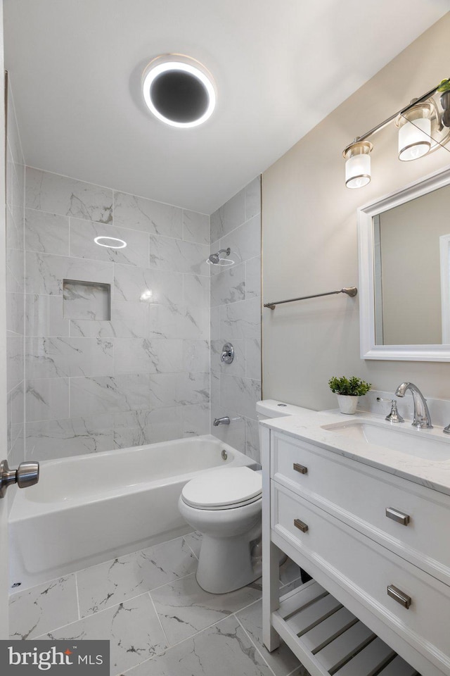 bathroom with vanity, shower / tub combination, toilet, and marble finish floor