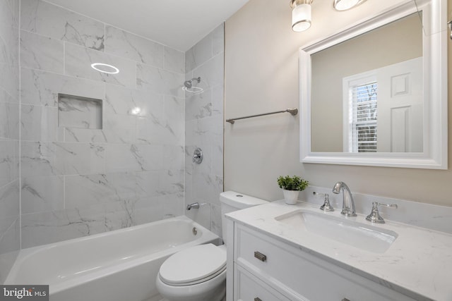 bathroom featuring toilet, bathtub / shower combination, and vanity