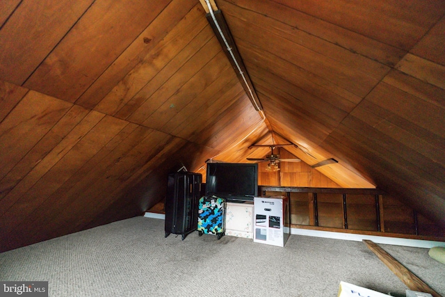 additional living space featuring ceiling fan, wooden ceiling, and carpet flooring