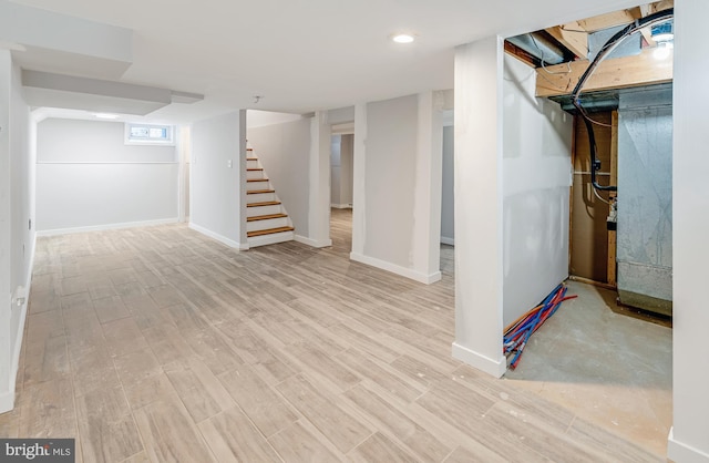 basement featuring light hardwood / wood-style flooring