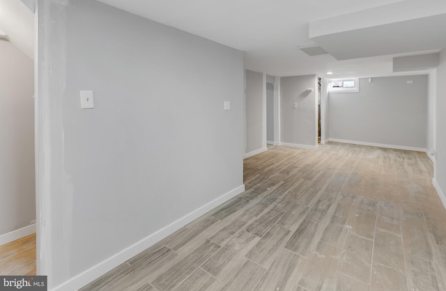 basement featuring light wood-type flooring