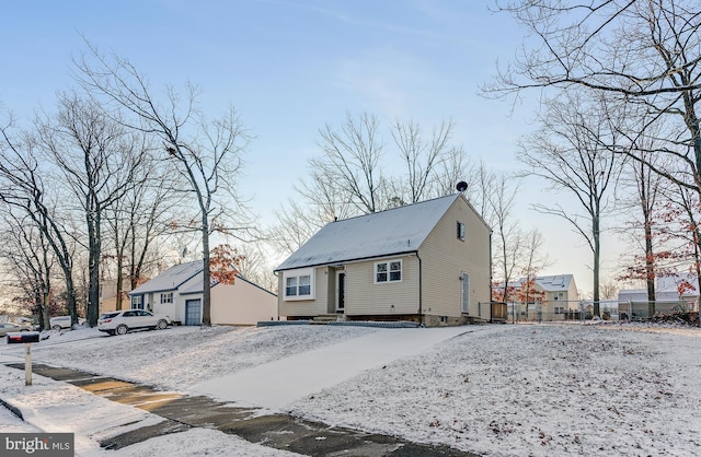 view of snow covered rear of property