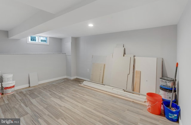 basement featuring light wood-type flooring